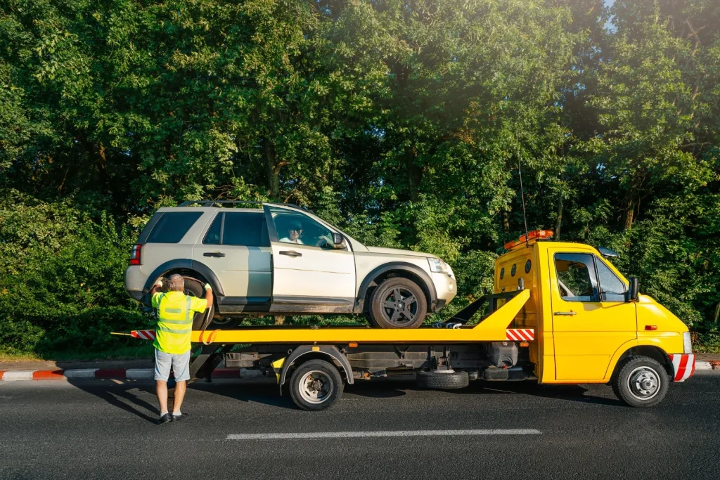 car being towed away with a person still in it