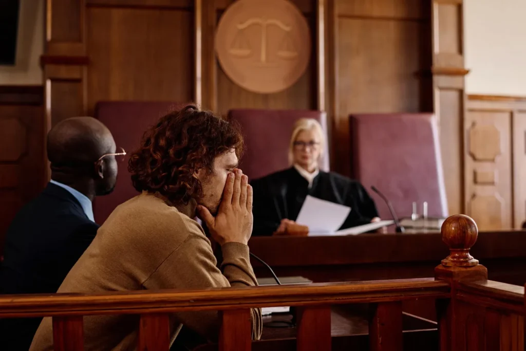 a man in a court of law looking distressed