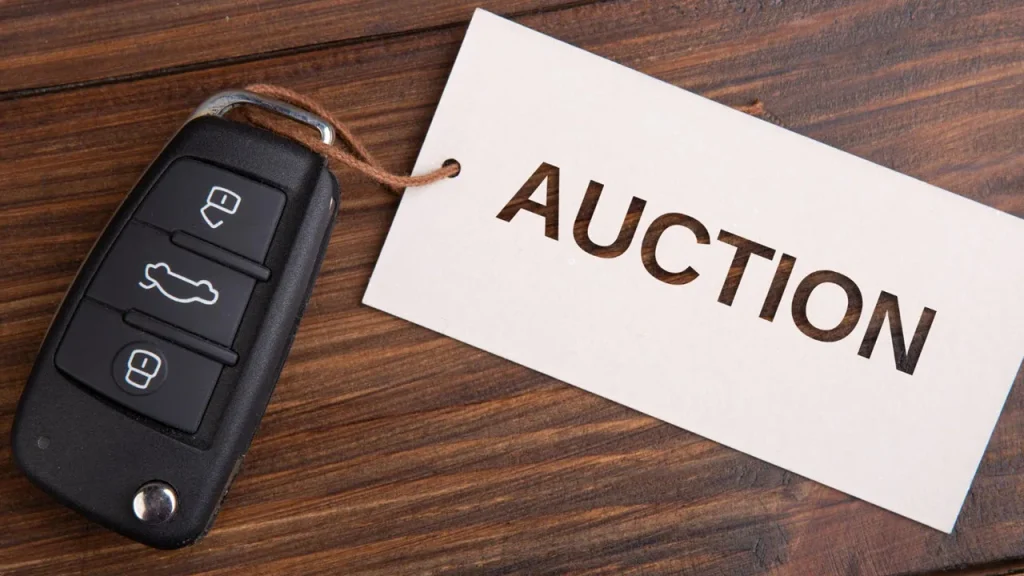 car keys with auction tag attached to them