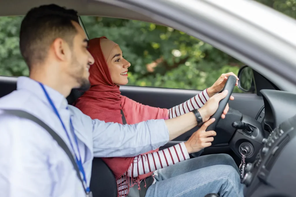 husband teaching his wife how to drive